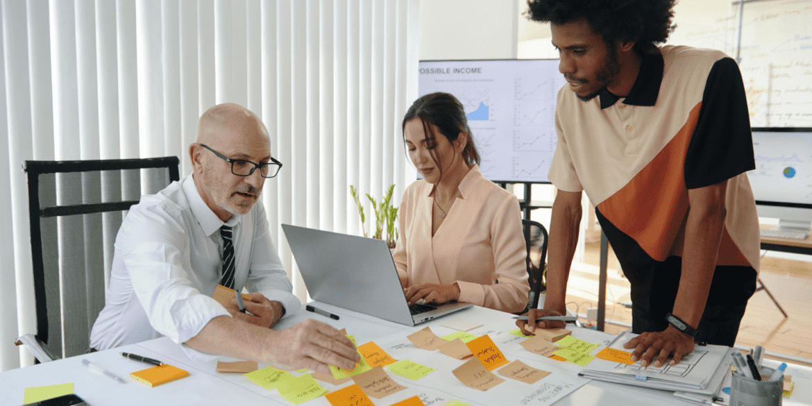 Business people planning work in a team to identify and reduce operational inefficiencies.