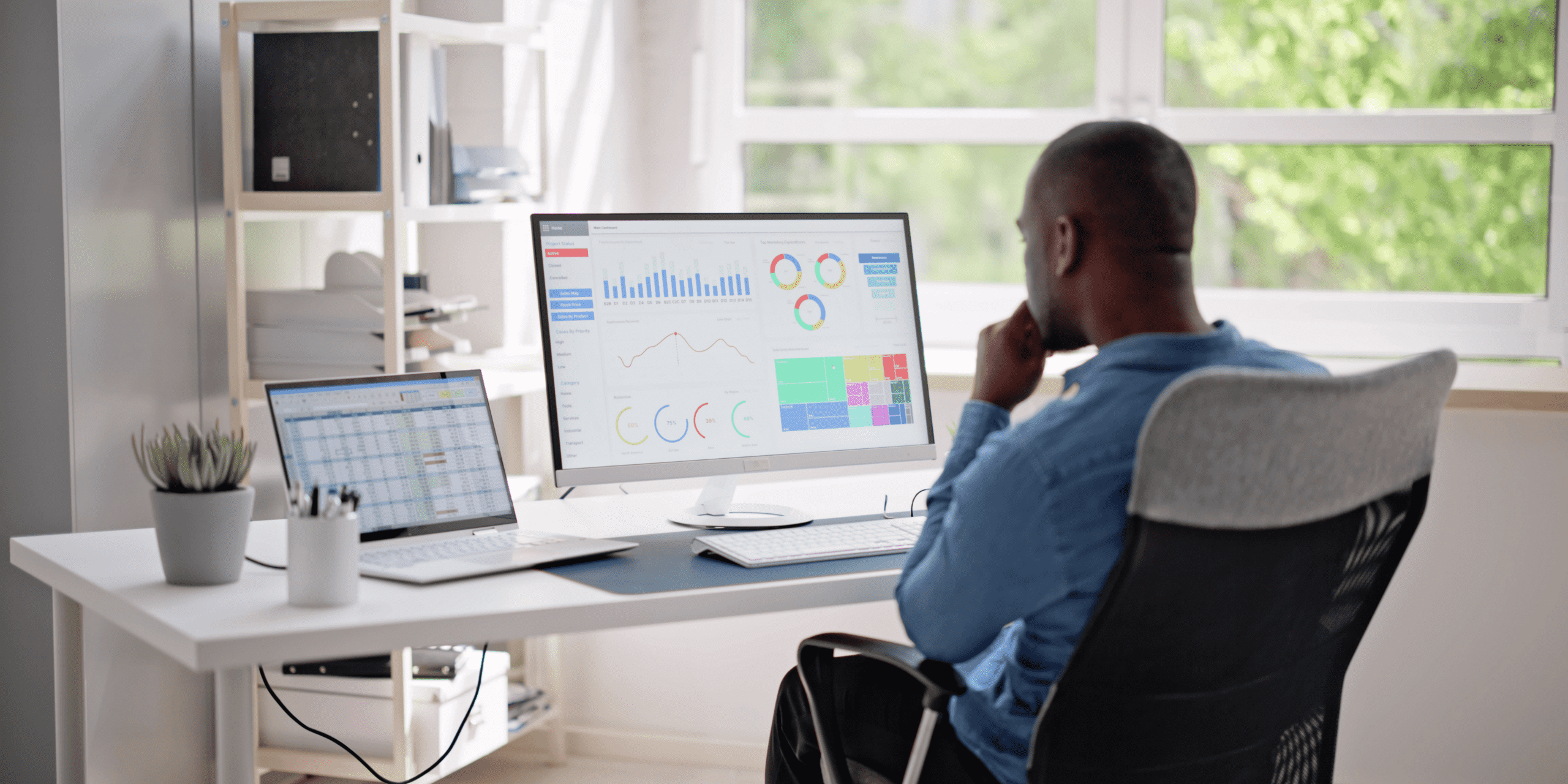 Businessman using an operations dashboard to support decision making