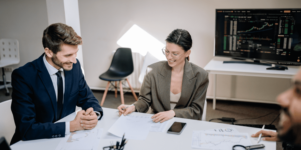 Professionals discussing workforce analytics vs HR analytics during a business meeting